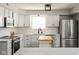Beautiful kitchen with white cabinets, stainless steel appliances, a butcher block island, and pendant lighting at 4625 Elkhorn Ct, Noblesville, IN 46062