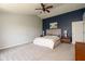 Spacious main bedroom with a vaulted ceiling, stylish accent wall, and plush carpeting at 4625 Elkhorn Ct, Noblesville, IN 46062