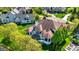 Stunning aerial view of a beautiful home with a well-manicured lawn, mature trees and neighborhood at 4726 Ellery Ln, Indianapolis, IN 46250