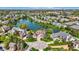 Panoramic aerial view of luxurious homes surrounding a tranquil lake in a well-established community at 4726 Ellery Ln, Indianapolis, IN 46250