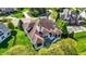 Aerial view of a home showcasing the backyard, patio, mature trees and an outdoor living space at 4726 Ellery Ln, Indianapolis, IN 46250