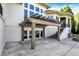 Outdoor patio features a wooden pergola, access to second story and steps down to a fire pit at 4726 Ellery Ln, Indianapolis, IN 46250