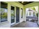 Covered patio area with water views and a door to the inside and outside of the house at 4726 Ellery Ln, Indianapolis, IN 46250