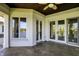 Spacious covered balcony with a lake view, multiple doors, and neutral colors at 4726 Ellery Ln, Indianapolis, IN 46250