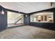 Beautiful basement with carpet flooring, black walls, decorative lighting, and staircase at 4726 Ellery Ln, Indianapolis, IN 46250