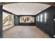 Spacious basement features neutral carpet, dark accent walls, and unique architectural details at 4726 Ellery Ln, Indianapolis, IN 46250