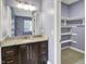 Bathroom vanity featuring granite countertops and a spacious closet at 4726 Ellery Ln, Indianapolis, IN 46250