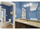 Stylish bathroom with granite countertops, dark wood cabinetry, and a well-lit mirror at 4726 Ellery Ln, Indianapolis, IN 46250