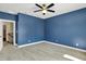 Spacious bedroom with modern ceiling fan and neutral carpet at 4726 Ellery Ln, Indianapolis, IN 46250