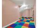 Large bonus room with unique flooring and plenty of space for activities or storage at 4726 Ellery Ln, Indianapolis, IN 46250