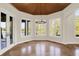 Bright breakfast nook with views of the water, a decorative ceiling, and access to the back deck at 4726 Ellery Ln, Indianapolis, IN 46250