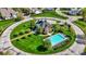 Aerial view of a community clubhouse and pool surrounded by lush landscaping in a well-planned neighborhood at 4726 Ellery Ln, Indianapolis, IN 46250