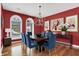 Formal dining room featuring hardwood floors, a chandelier, stylish furniture, and elegant décor at 4726 Ellery Ln, Indianapolis, IN 46250