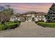Elegant home with a grand facade, featuring manicured landscaping, architectural details, and a spacious driveway at 4726 Ellery Ln, Indianapolis, IN 46250