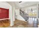An expansive foyer showcases a staircase, hardwood floors, and natural light streaming through large windows at 4726 Ellery Ln, Indianapolis, IN 46250