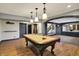 Game room featuring a pool table, hardwood floors, and a wet bar at 4726 Ellery Ln, Indianapolis, IN 46250