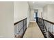 Open hallway with carpet and decorative railing, providing a spacious feel at 4726 Ellery Ln, Indianapolis, IN 46250