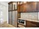 Custom dark wood cabinets, granite counters and stainless appliances make this kitchen a chef's dream at 4726 Ellery Ln, Indianapolis, IN 46250