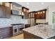 Gourmet kitchen featuring stainless steel appliances and a spacious granite island for dining and meal prep at 4726 Ellery Ln, Indianapolis, IN 46250