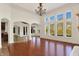 Bright and airy living room featuring floor-to-ceiling windows and hardwood floors at 4726 Ellery Ln, Indianapolis, IN 46250