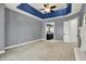 Spacious main bedroom with a tray ceiling and access to an en-suite bathroom at 4726 Ellery Ln, Indianapolis, IN 46250