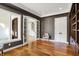 A bright office features neutral walls, built-in shelves, and French doors leading to other rooms at 4726 Ellery Ln, Indianapolis, IN 46250