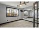 Bright room featuring a large mirror, windows, ceiling fan, and recessed lighting at 4726 Ellery Ln, Indianapolis, IN 46250