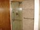 Bathroom featuring a glass enclosed shower stall with a tiled surround and grab bars at 4806 Krestridge E Ct, Bargersville, IN 46106