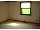 Bedroom with striped wallpaper and a window view of green space, bright sunlight at 4806 Krestridge E Ct, Bargersville, IN 46106