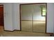 Bedroom with mirrored closet and a large window offering natural light at 4806 Krestridge E Ct, Bargersville, IN 46106
