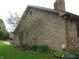 Side view of the brick home showing the exterior architecture and landscaping at 4806 Krestridge E Ct, Bargersville, IN 46106