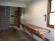 Garage with long workbench, shelving, and natural light from the side window at 4806 Krestridge E Ct, Bargersville, IN 46106