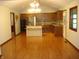 Open concept kitchen with wood cabinets, stainless steel appliances, and large center island at 4806 Krestridge E Ct, Bargersville, IN 46106