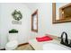 Cozy bathroom with a stained glass window, wreath, and updated fixtures at 5001 Woodrose Ln, Anderson, IN 46011