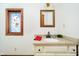 Bright bathroom with a granite countertop, framed mirror, and decorative stained-glass window at 5001 Woodrose Ln, Anderson, IN 46011