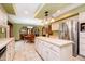 Kitchen features a large center island, stainless appliances, and tile flooring at 5001 Woodrose Ln, Anderson, IN 46011