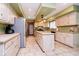 Spacious kitchen features tiled floors, island, and white cabinets at 5001 Woodrose Ln, Anderson, IN 46011