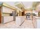 Spacious kitchen features stainless steel appliances, a center island, and ample cabinet space at 5001 Woodrose Ln, Anderson, IN 46011