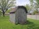 This backyard features a wooden shed providing plenty of extra storage space for tools or equipment at 5107 Saddle Ln, Anderson, IN 46013