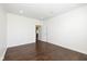 Bright, empty bedroom features neutral paint and wood floors at 5141 S Cobblestone Dr, Zionsville, IN 46077