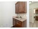 Charming butler pantry with custom cabinetry, granite counters, and convenient access to the laundry area at 5141 S Cobblestone Dr, Zionsville, IN 46077