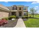 Charming home featuring a stone and brick facade with a well-manicured front garden at 5141 S Cobblestone Dr, Zionsville, IN 46077