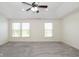 Spacious main bedroom features two windows offering natural light and soft carpet flooring at 5141 S Cobblestone Dr, Zionsville, IN 46077