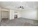 Bright main bedroom with a ceiling fan leading to a walk-in closet and ensuite bathroom at 5141 S Cobblestone Dr, Zionsville, IN 46077