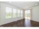 Bright sun room with multiple windows and a sliding door provides backyard view at 5141 S Cobblestone Dr, Zionsville, IN 46077