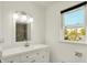 Modern bathroom with white vanity, updated lighting, and large mirror at 5354 Brendon Park Dr, Indianapolis, IN 46226