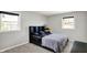 This bedroom features neutral walls, carpet, and a built-in headboard with a fish tank on a side table at 5354 Brendon Park Dr, Indianapolis, IN 46226
