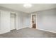 Bedroom with neutral walls and carpet, a closet, and an open door to another room at 5354 Brendon Park Dr, Indianapolis, IN 46226