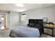 This bedroom features neutral walls, carpet, and a built-in headboard with a fish tank on a side table at 5354 Brendon Park Dr, Indianapolis, IN 46226