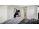 This bedroom features neutral walls, carpet, and a modern dresser with mounted mirror and TV at 5354 Brendon Park Dr, Indianapolis, IN 46226